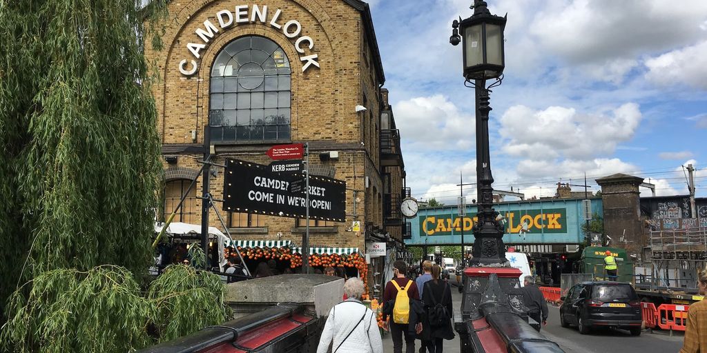 Camden Lock Market with people walking and vibrant surroundings.