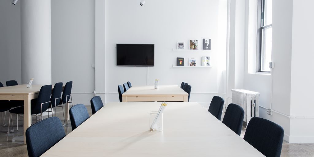 creative workspace with computer and design tools, integrating AI technology, modern office setting