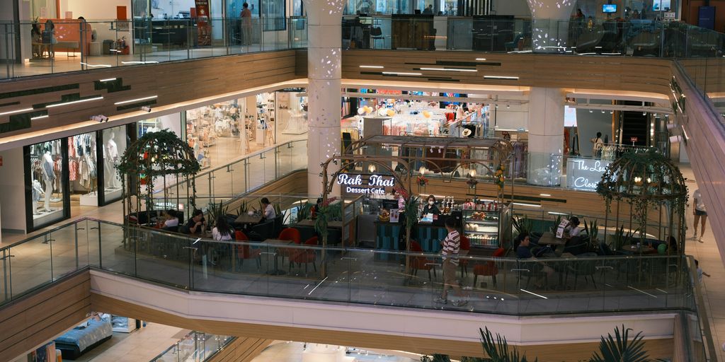 A large, modern shopping mall interior.