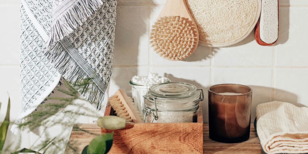 brown wooden chopping board beside clear glass jar