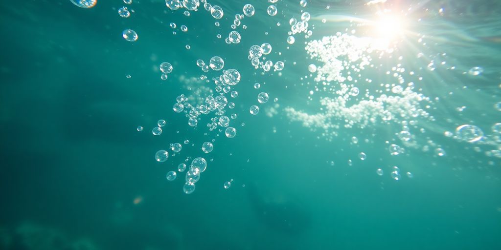 Clear blue water with bubbles rising