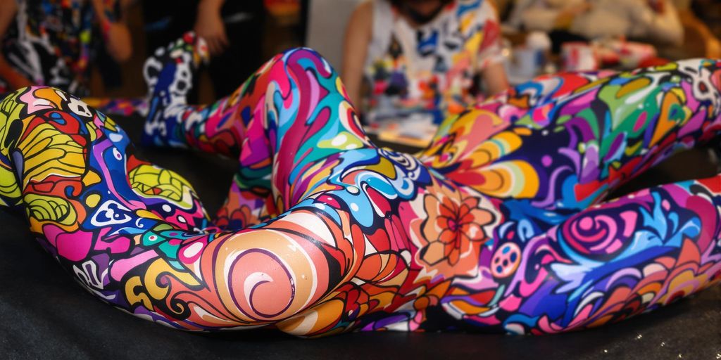 Colorful body painting on a model showcasing artistic expression.