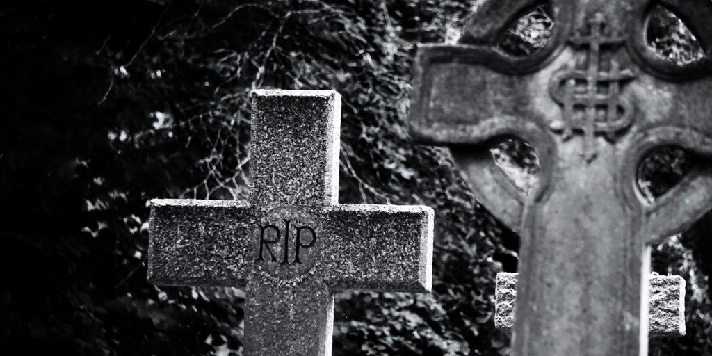 gray cross with cross on top of it