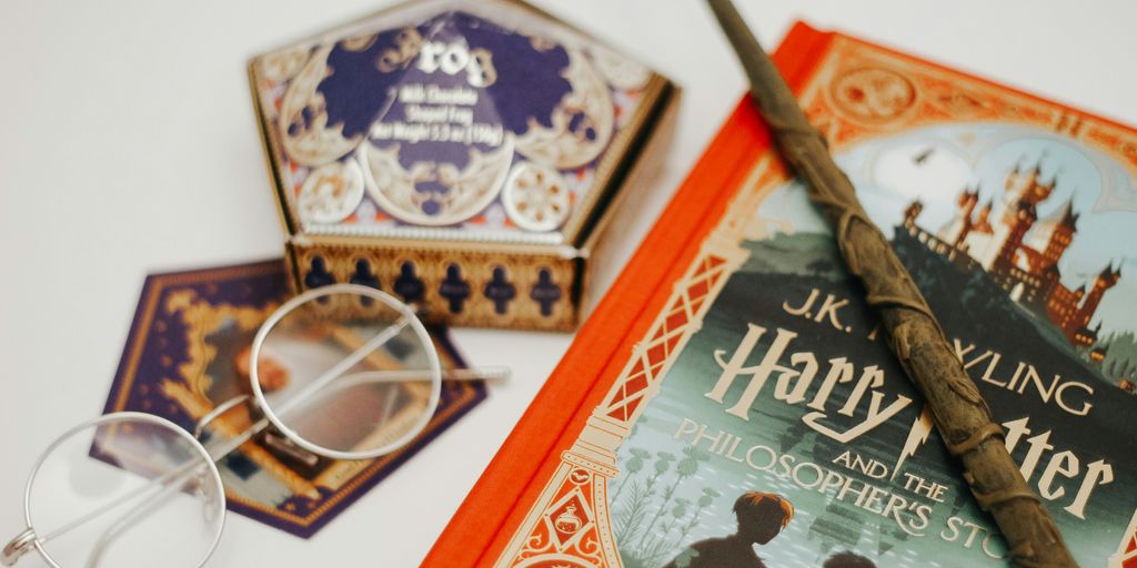 gold framed eyeglasses on red book