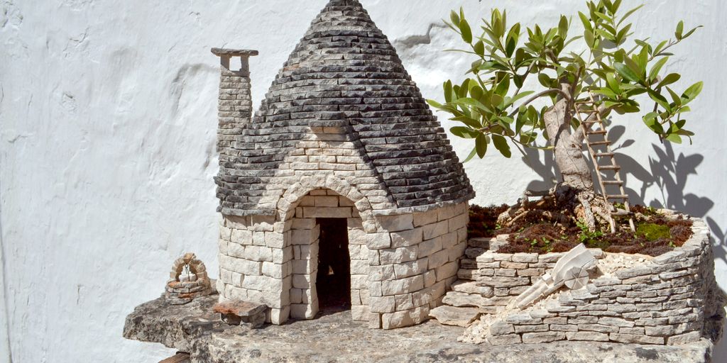 gray concrete house near green plants during daytime