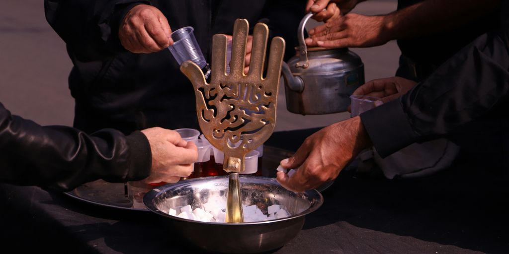 person holding stainless steel container