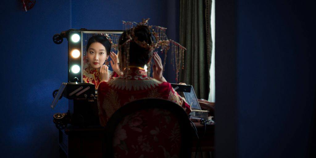 woman sitting in front of the mirror