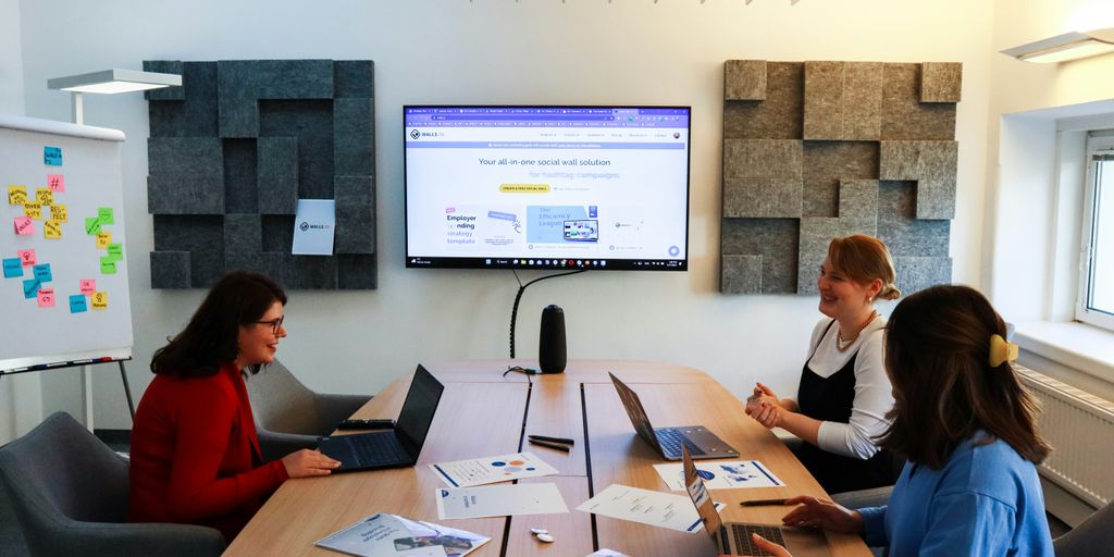 a group of people sitting around a conference table