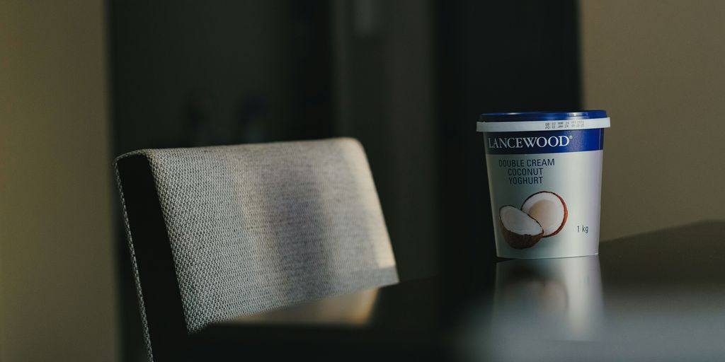 a cup of coffee sitting on top of a table