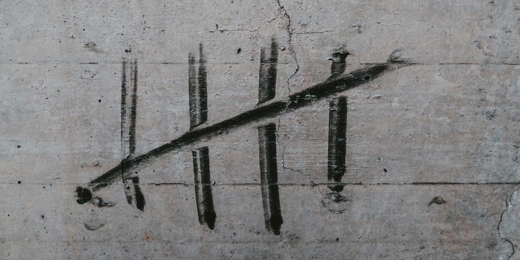 a piece of concrete with a line drawn on it