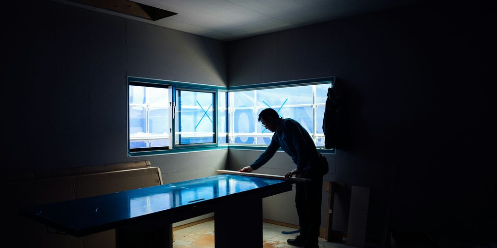silhouette photography of man inside dim-lighted room