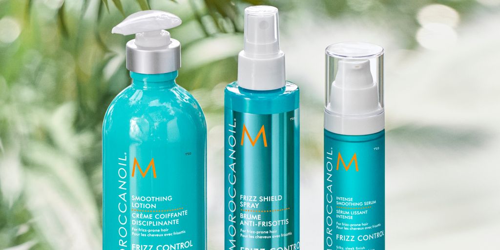 Haircare products displayed amidst lush greenery.