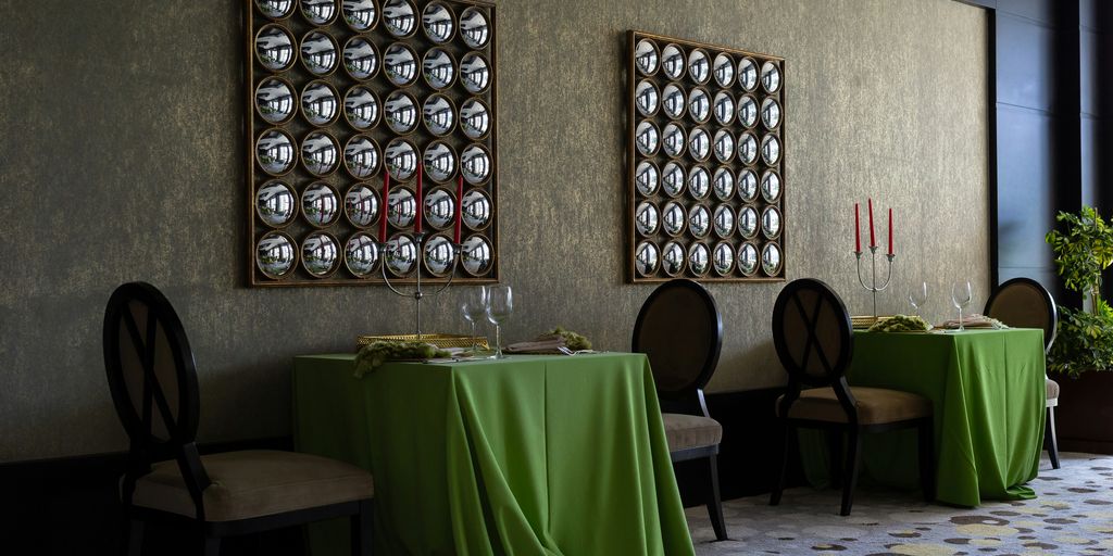 two green covered dining table set