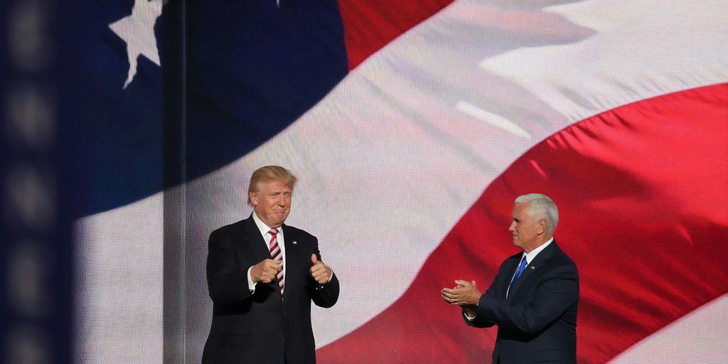 Donald Trump beside man in black suit
