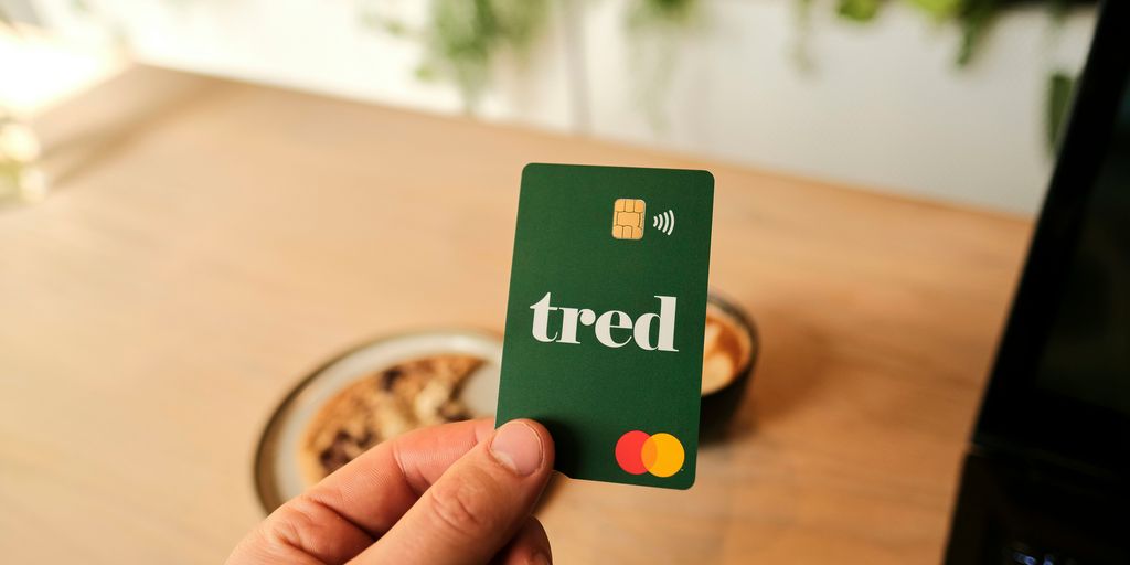 a person holding a credit card with the word tried on it