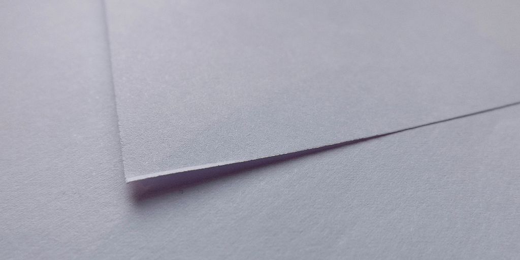 a black pen on a white surface