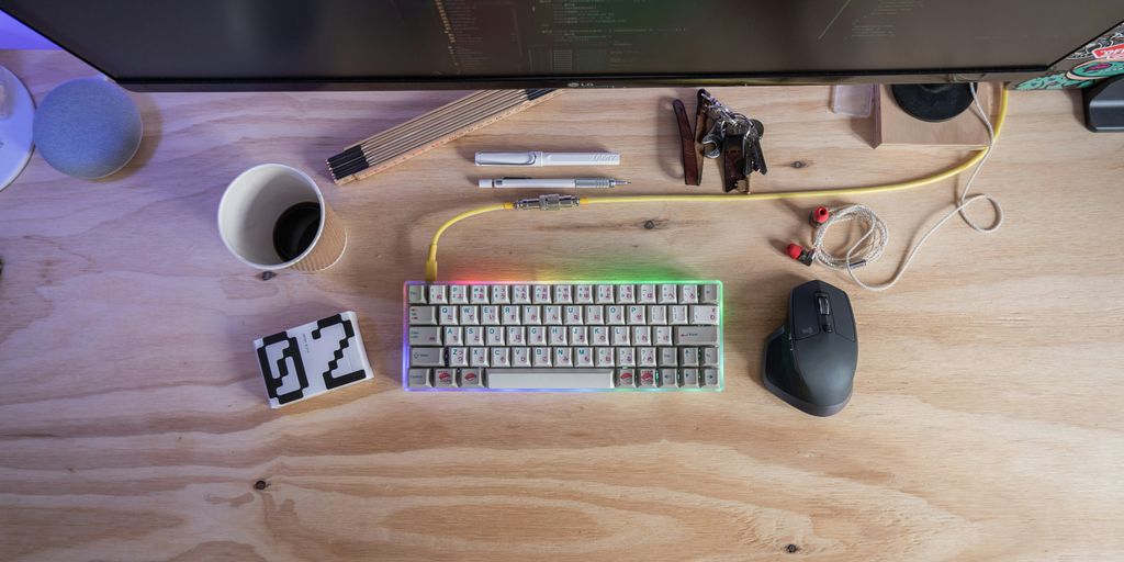 white computer keyboard beside mouse