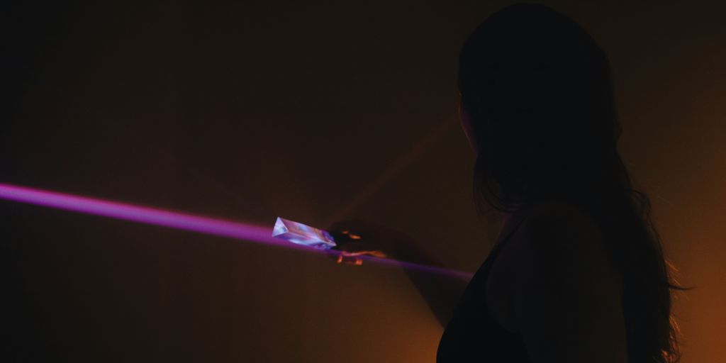 a person holding a light saber