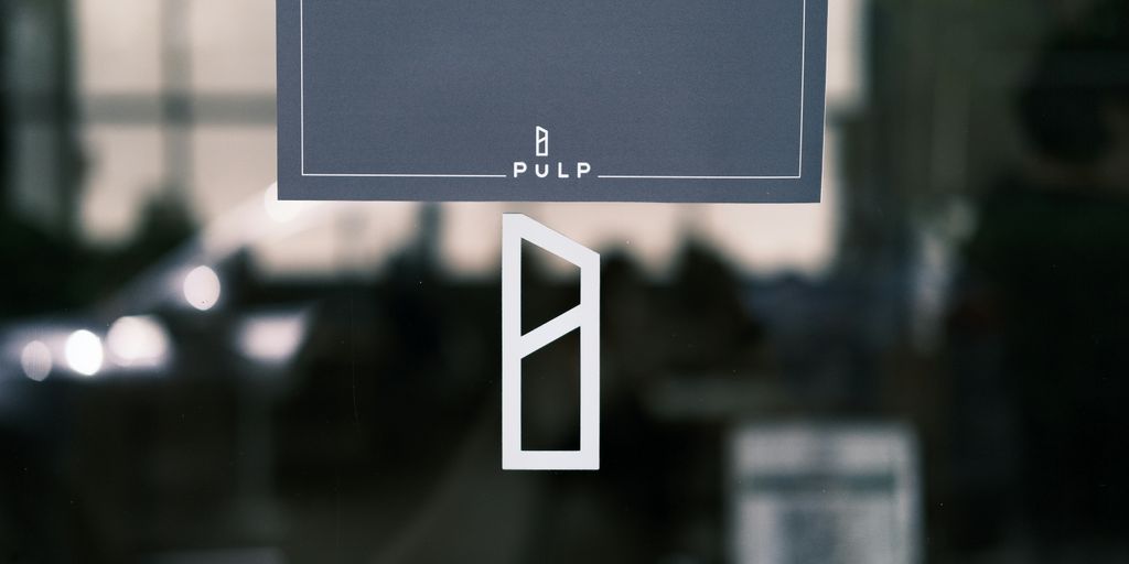 a close up of a sign on a glass door