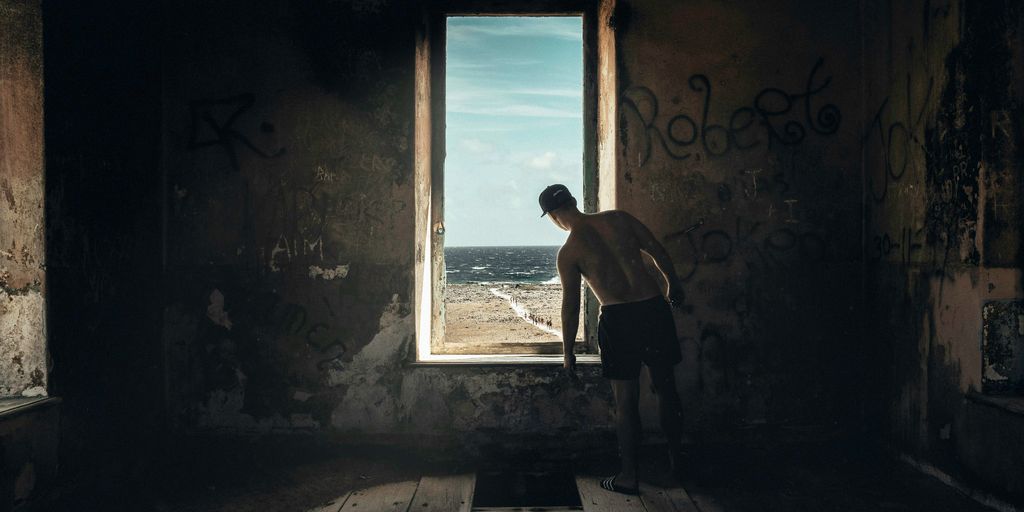 man peeping on window