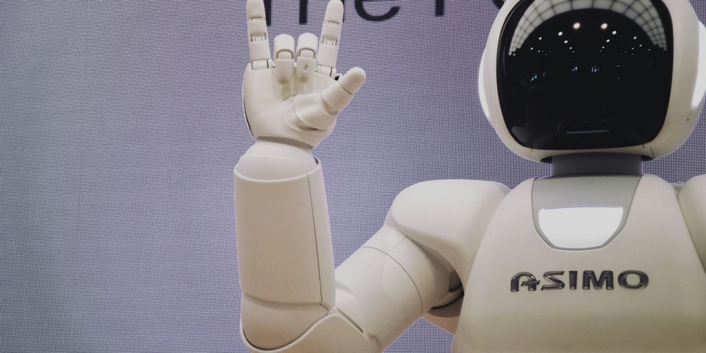 Asimo robot doing handsign