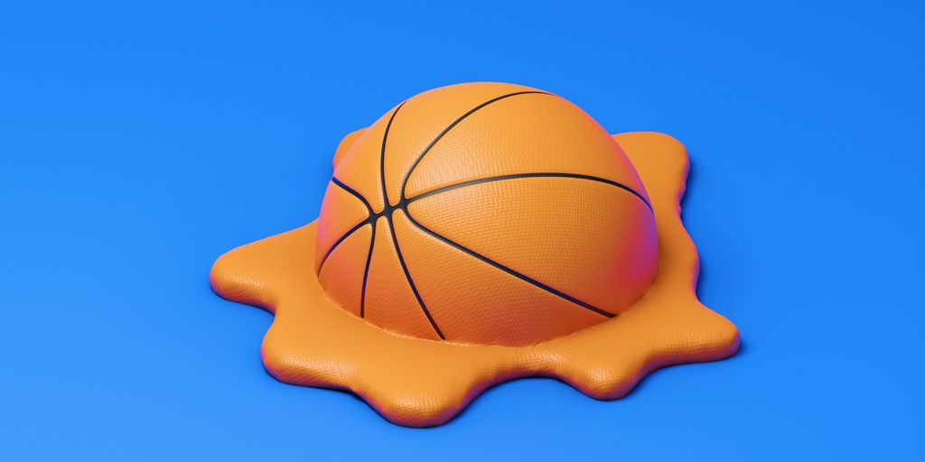 A basketball melting into a pool of liquid.
