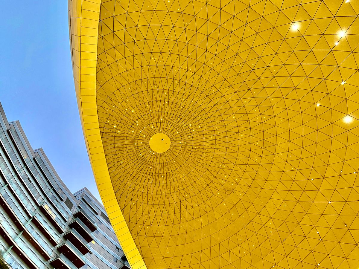 yellow sun shaped structure under blue sky during daytime