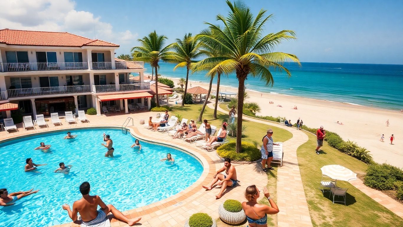 Large beachfront villa with pool and group of adults relaxing