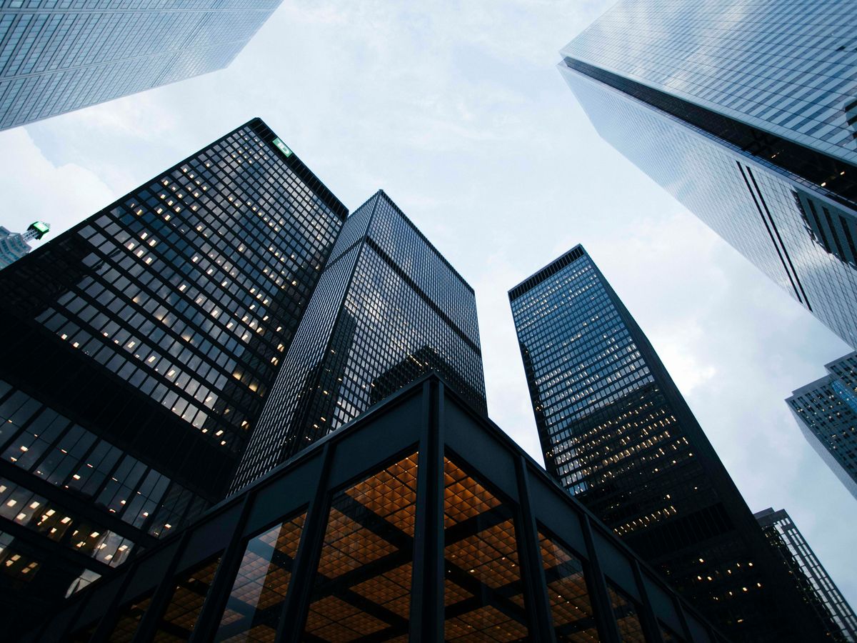 low angle photo of city high rise buildings during daytime