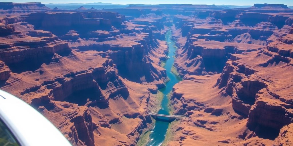 Helicopter flying over the vast, sunlit Grand Canyon.