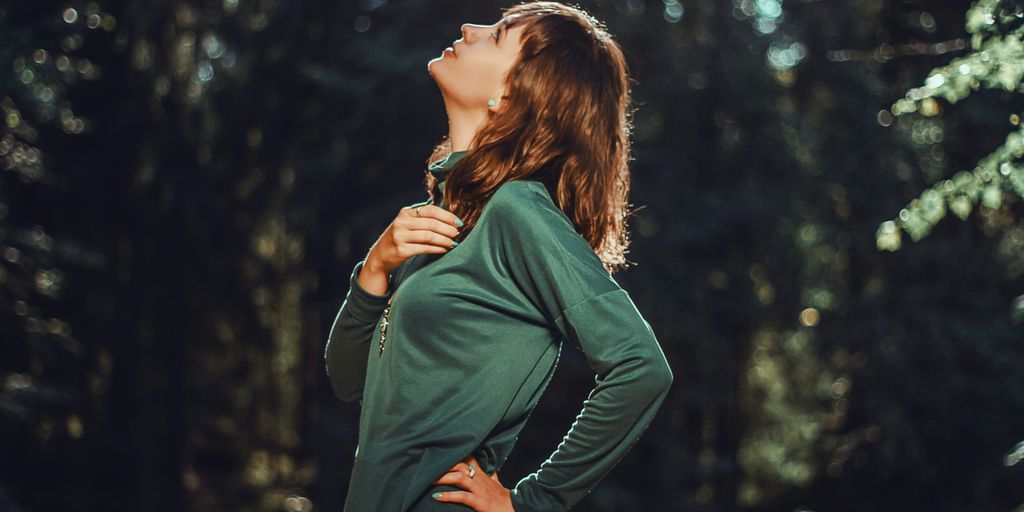selective focus photo of woman looking up