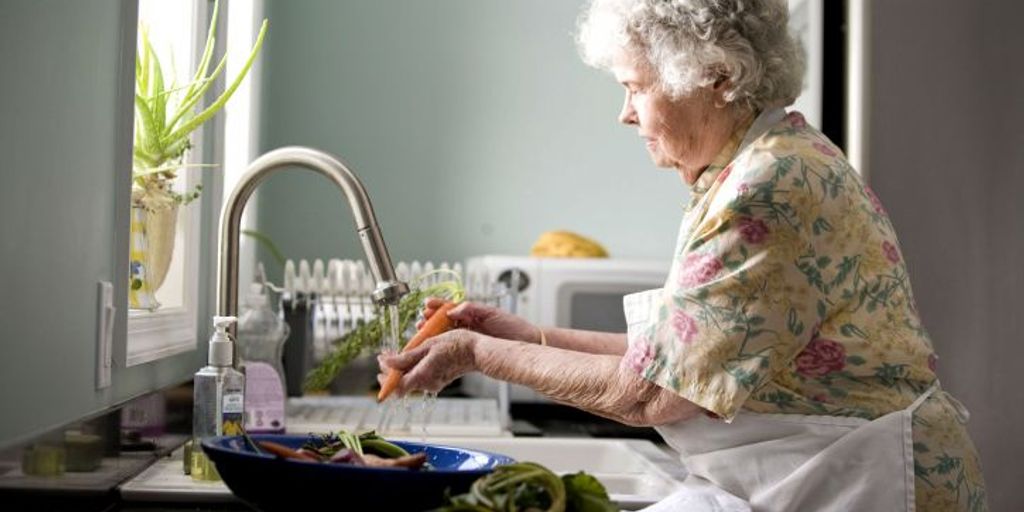 athlete preparing healthy meal in kitchen