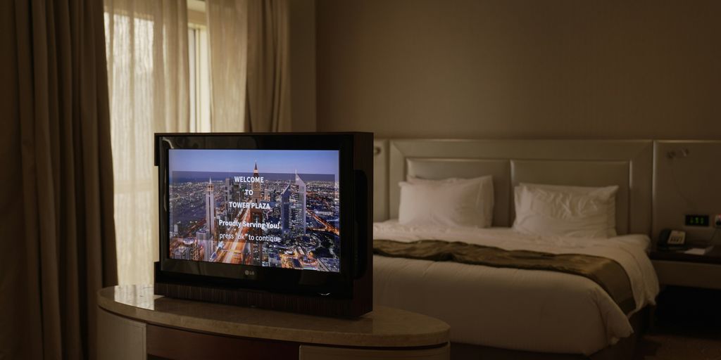 a flat screen tv sitting on top of a table