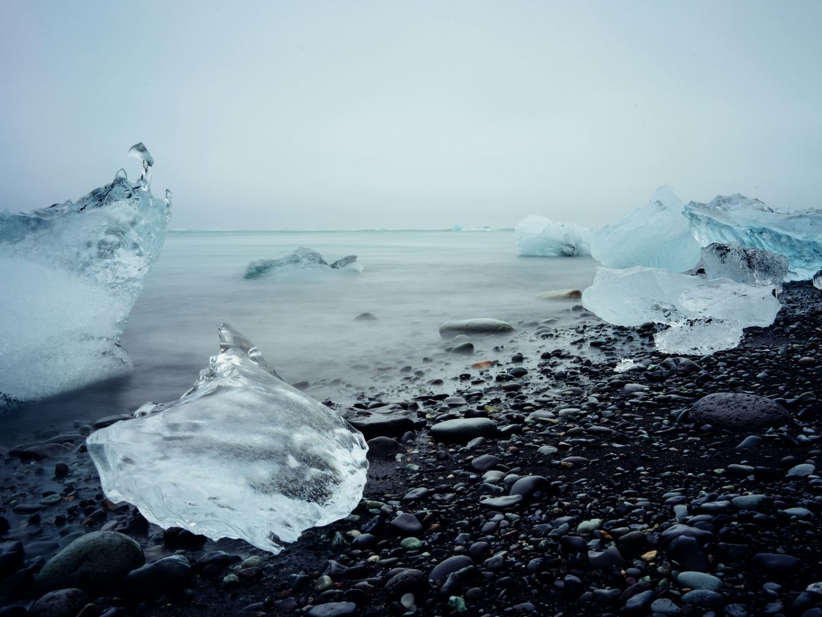 ice blocks on black stone fragment