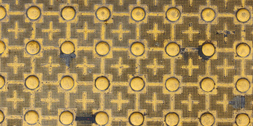 Yellow and black textured pavement pattern.