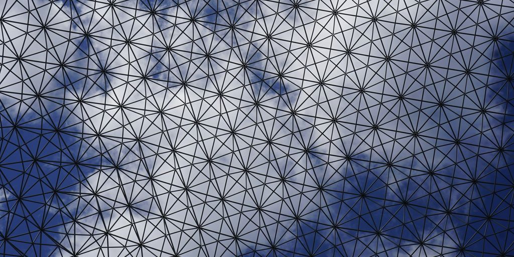 a close up of a building with a sky background