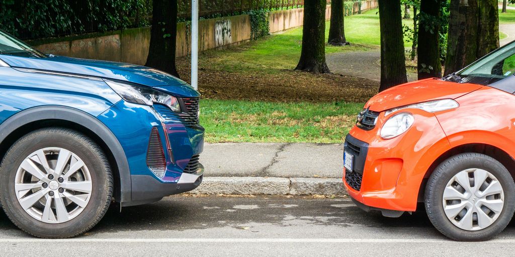 a couple of cars parked next to each other