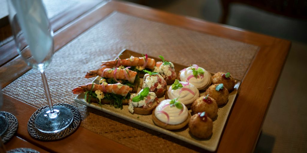 a wooden table topped with lots of food
