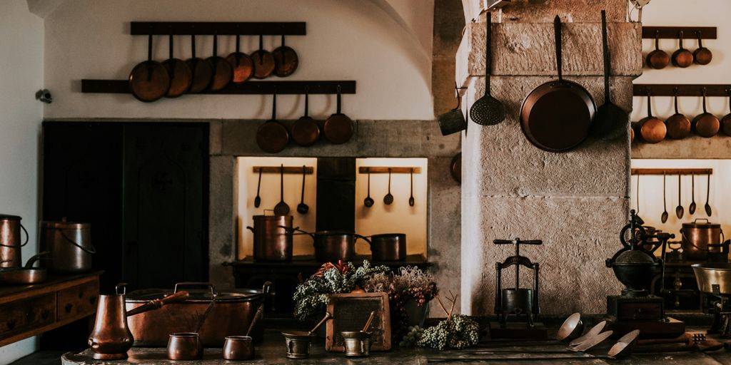 kitchen filled with cooking pans and kitchen utensils