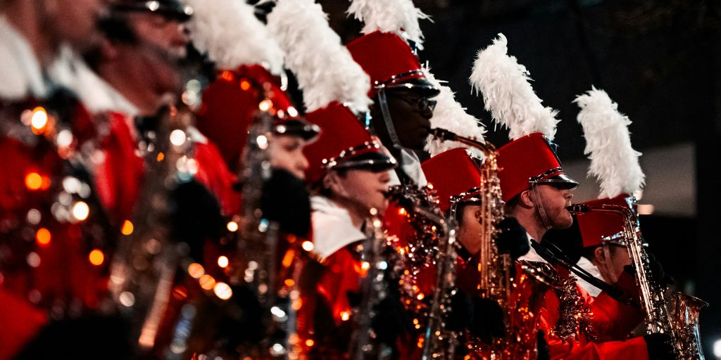 a group of people in red and white costumes