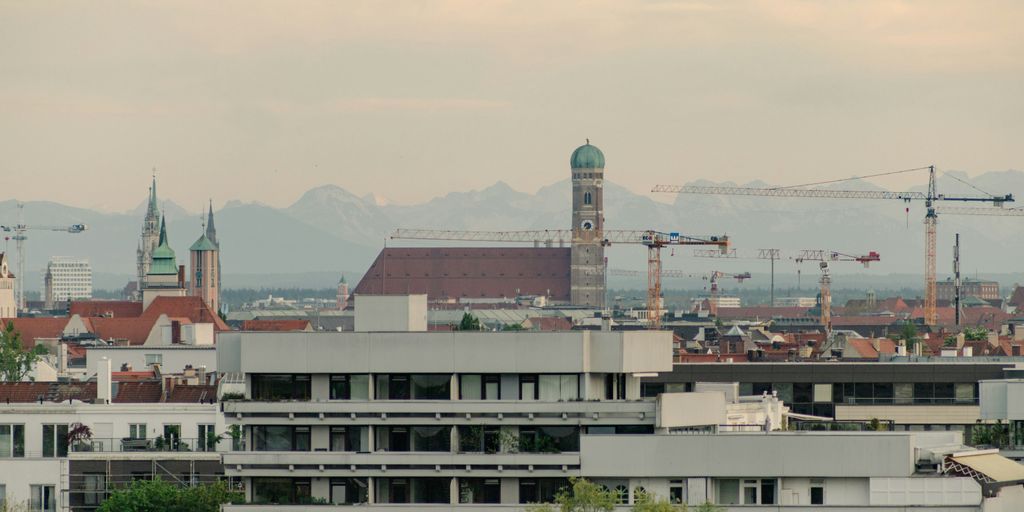 a view of a city with a clock tower in the background