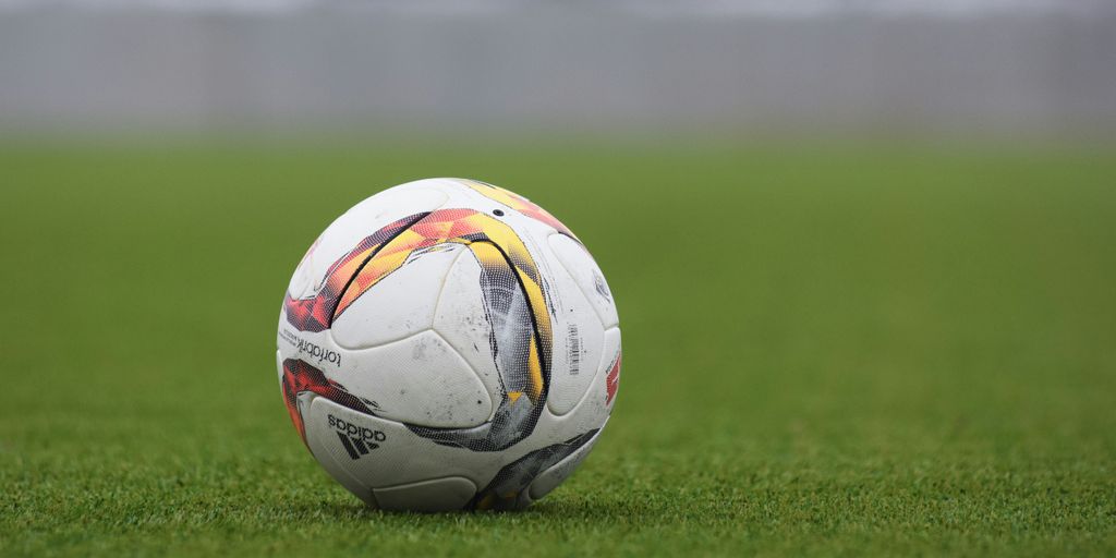 white and gray Adidas soccerball on lawn grass