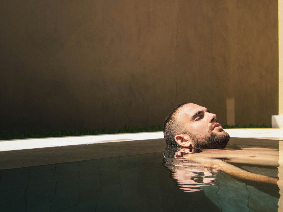 man floating on water