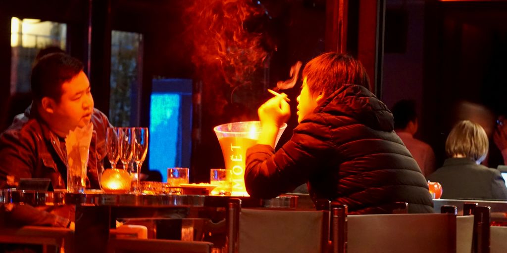 man in black long sleeve shirt smoking