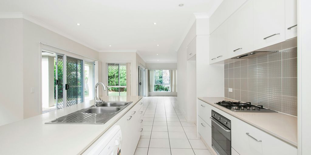 white wooden kitchen cupboards