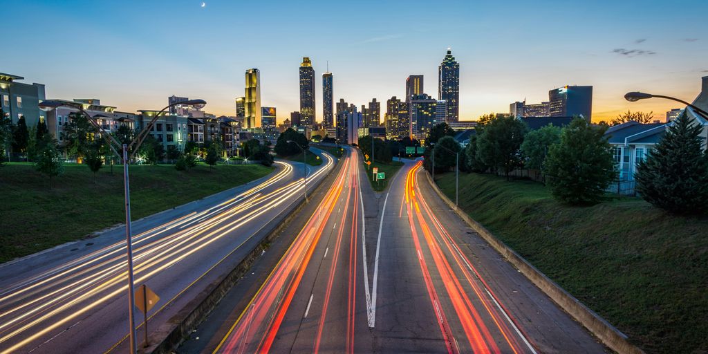 timelapse photo of highway during golden hour