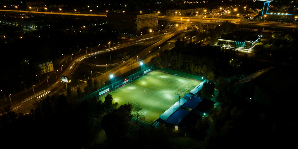 an aerial view of a tennis court at night