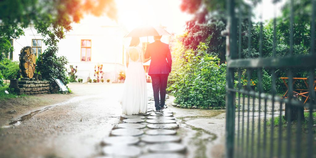 bride and groom walking on pathway