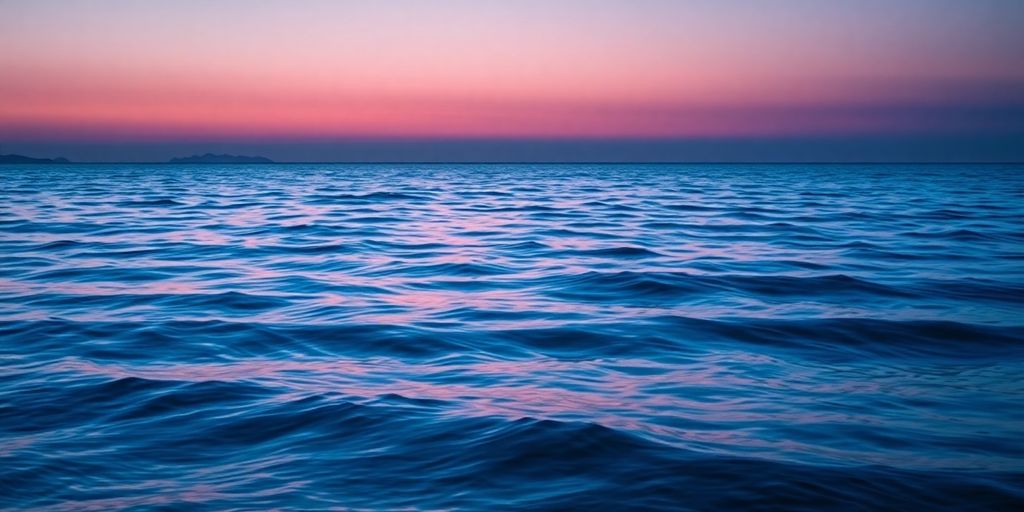 Tranquil landscape with calm water and twilight sky.