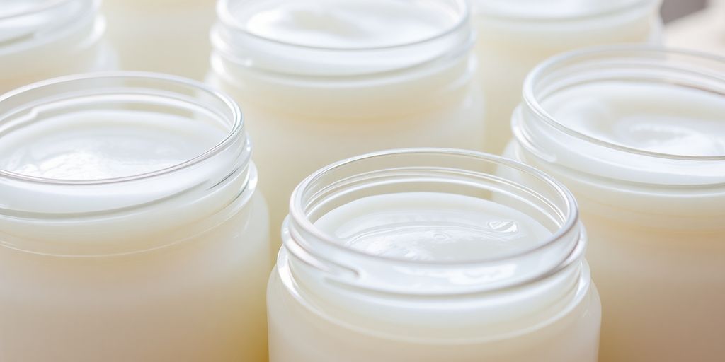Virgin coconut oil in clear jars.